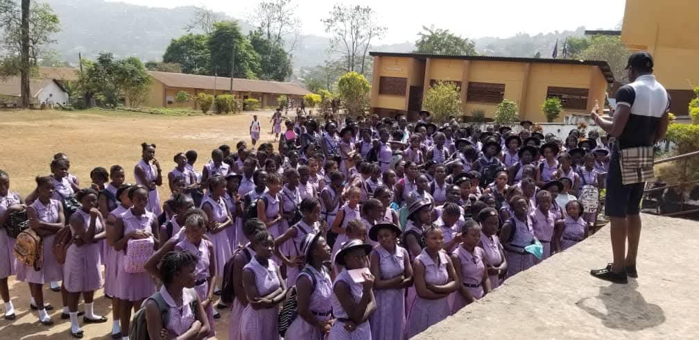 Women gathered at a community outreach event in Sierra Leone